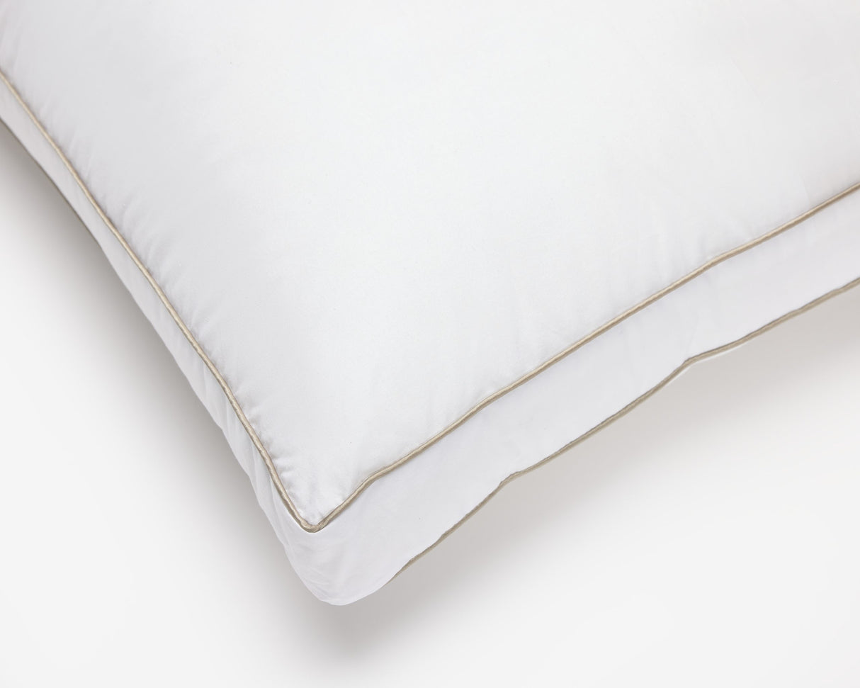 Close view of the corner of an O'zenith pillow, showing a detailed view of the sewing.