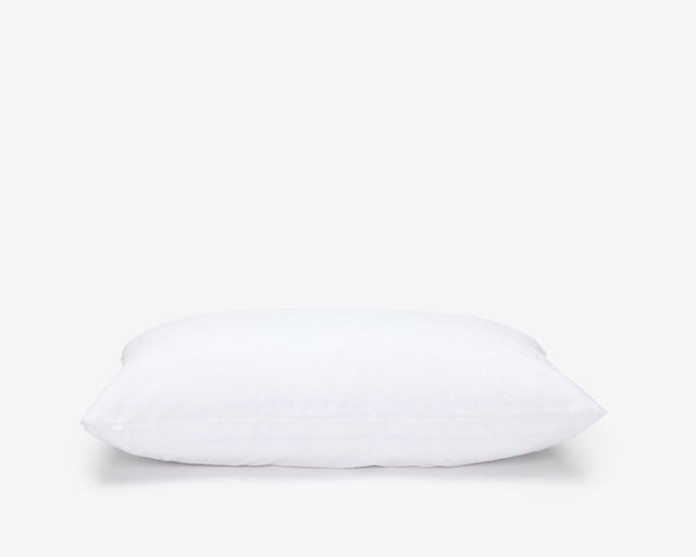 Hotel pillow featuring a white waterproof pillow protector.