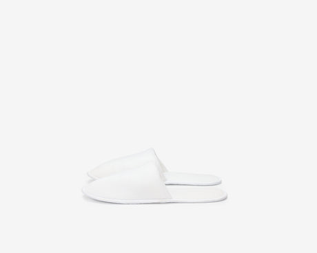 White closed toe slippers view from the side.