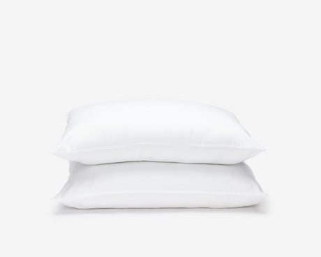 White hotel economic pillows, one on top of the other