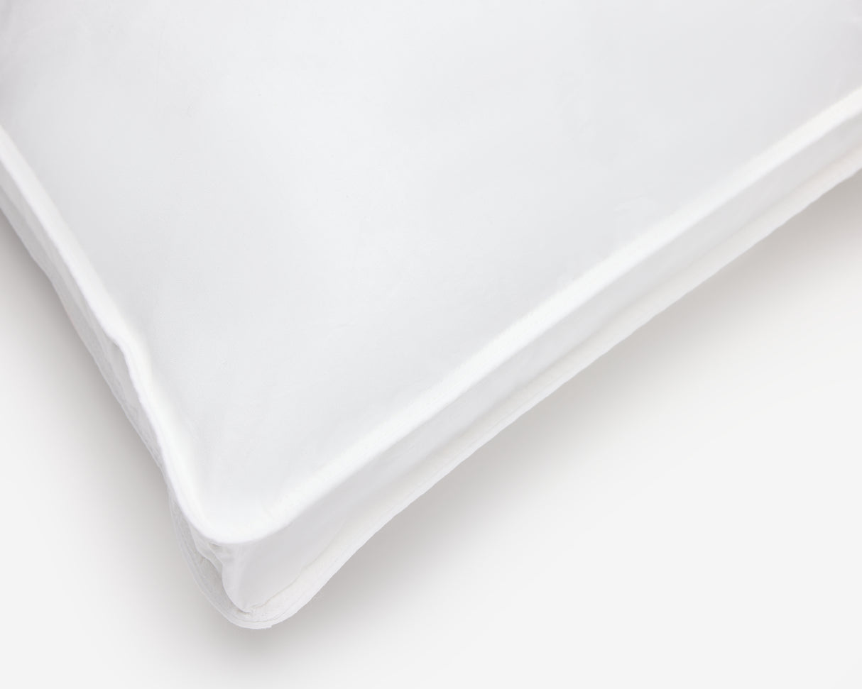 Corner of a white box hotel pillow.