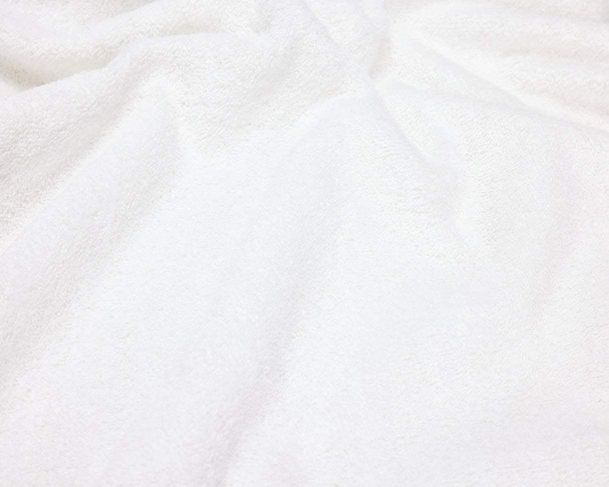 Close up view of a white hotel towel.