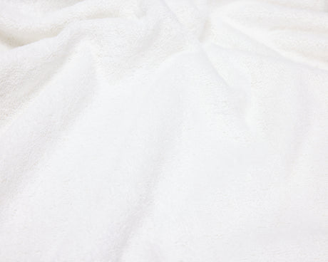 Close up view of a white hotel towel.
